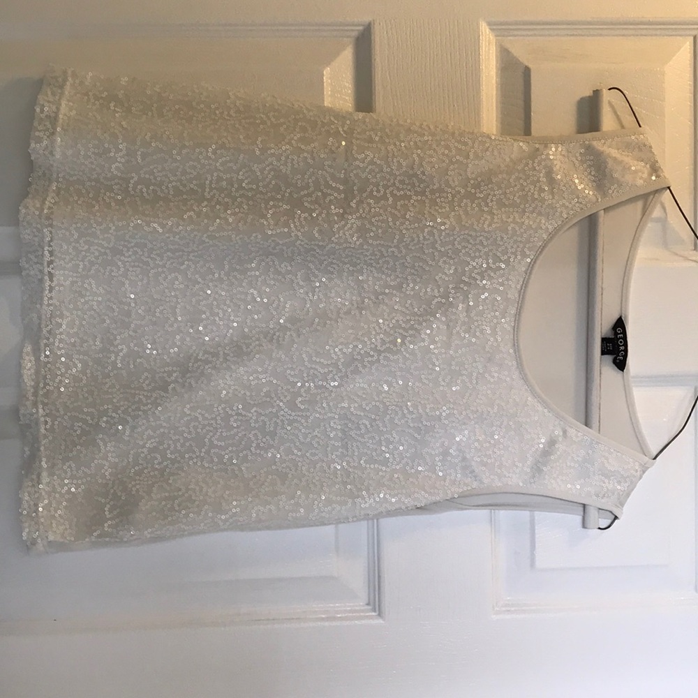 Cream colored, sequins front.